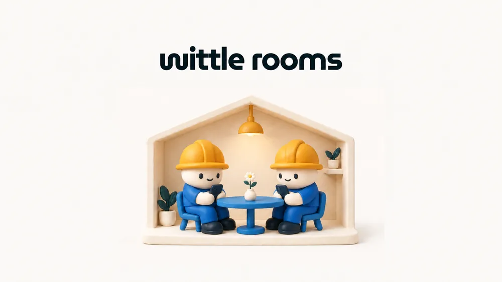Two clay builders using their phones together at a blue table